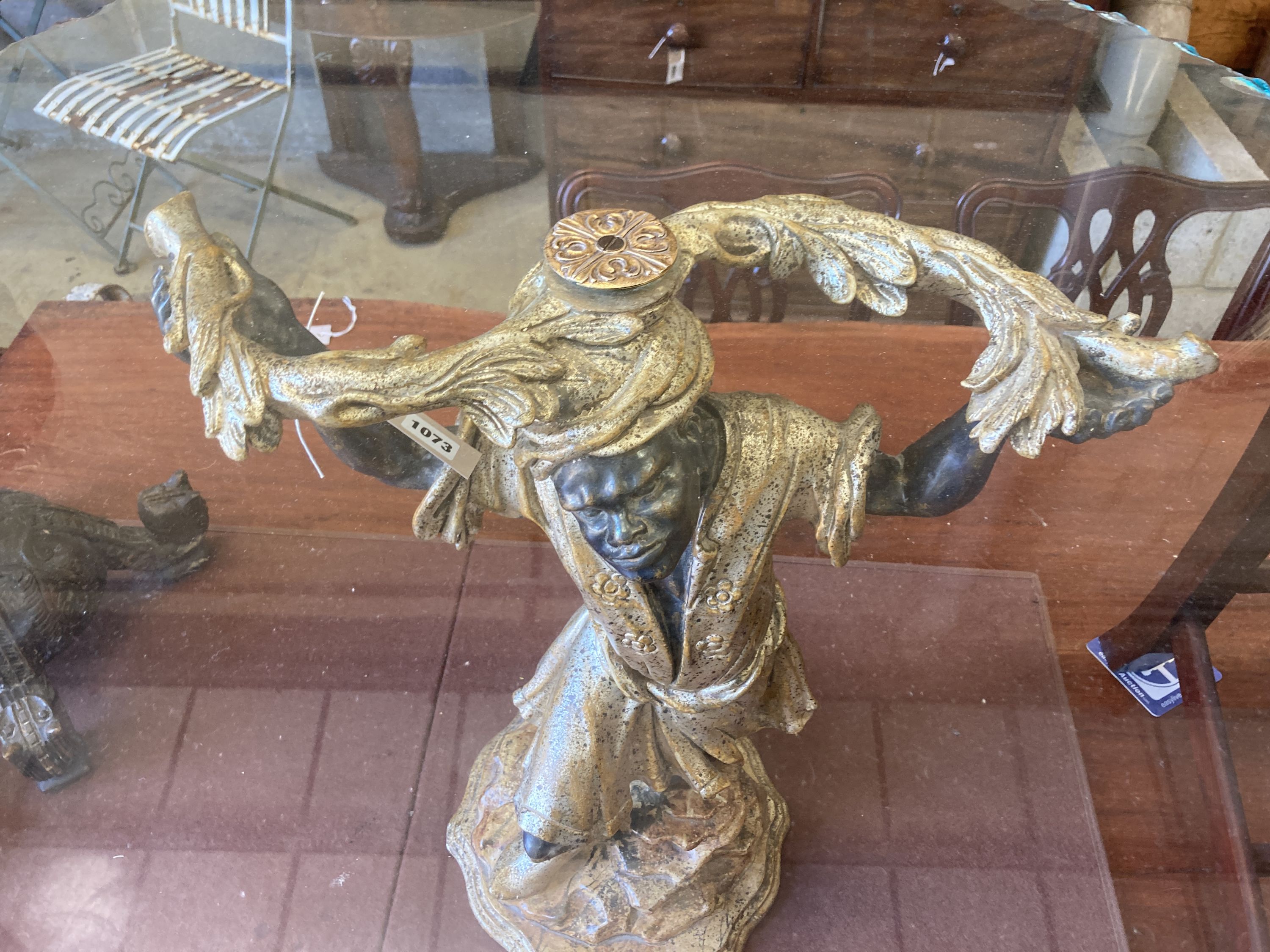 A reproduction Blackamoor table with circular glass top, diameter 80cm, height 63cm